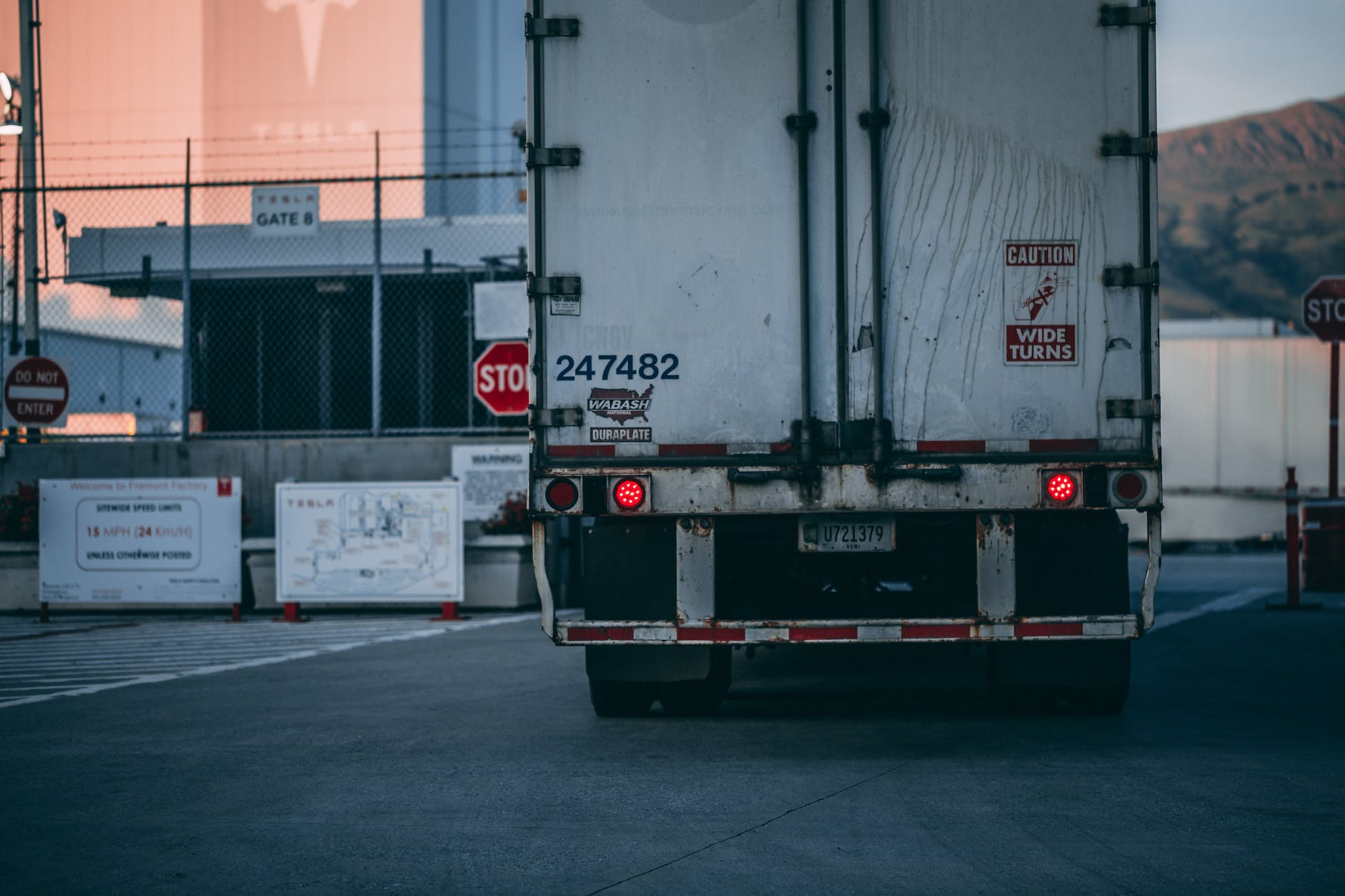 white freight truck close up photography